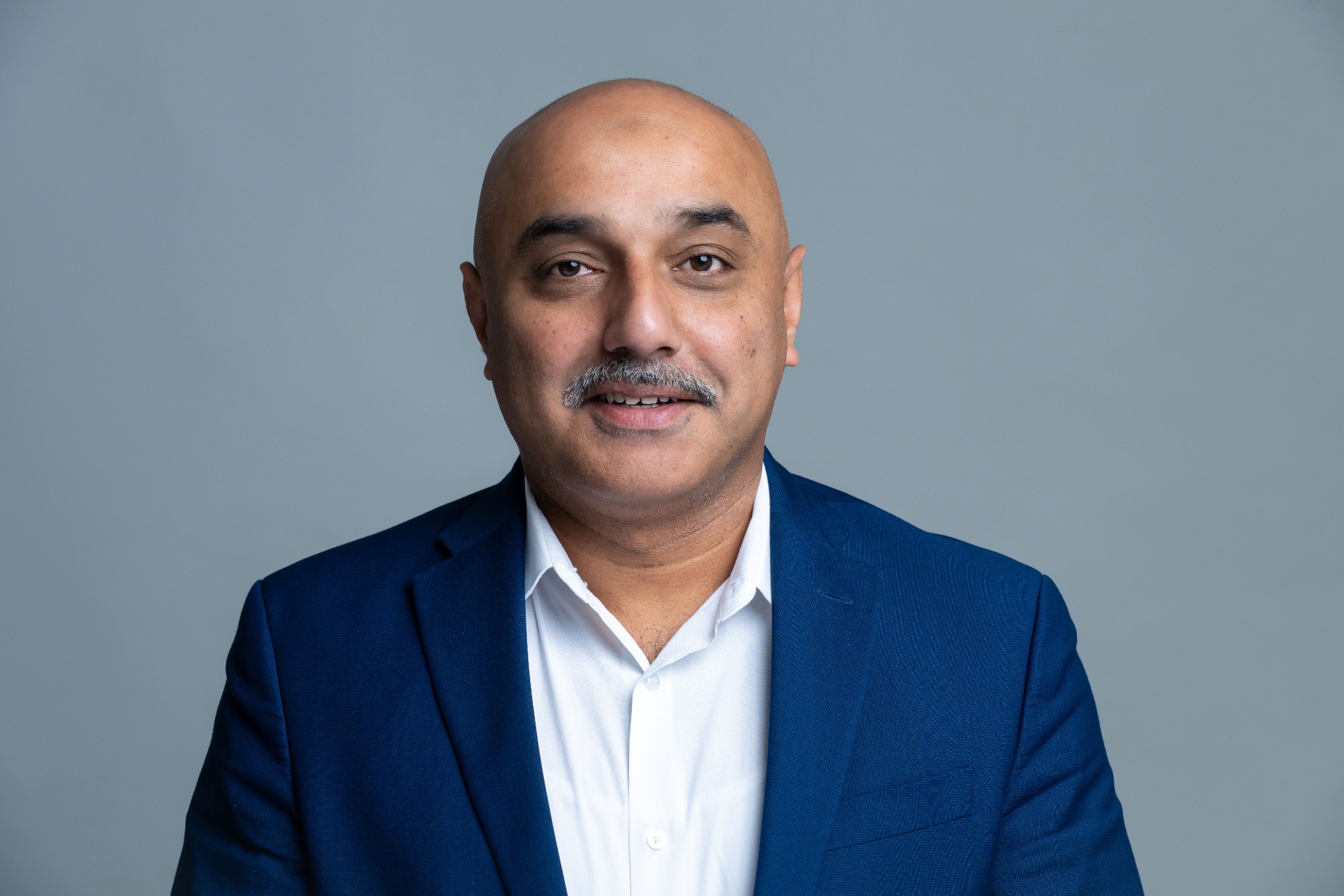 Professional portrait of Dr. Muhammad Hassan
